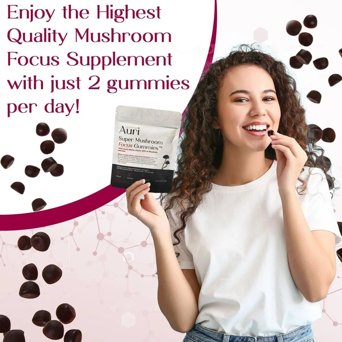 Girl holding one gummy in hand, product pack in other, gummies blurred in background, text: "Enjoy quality mushroom focus supplement – 2 gummies daily.