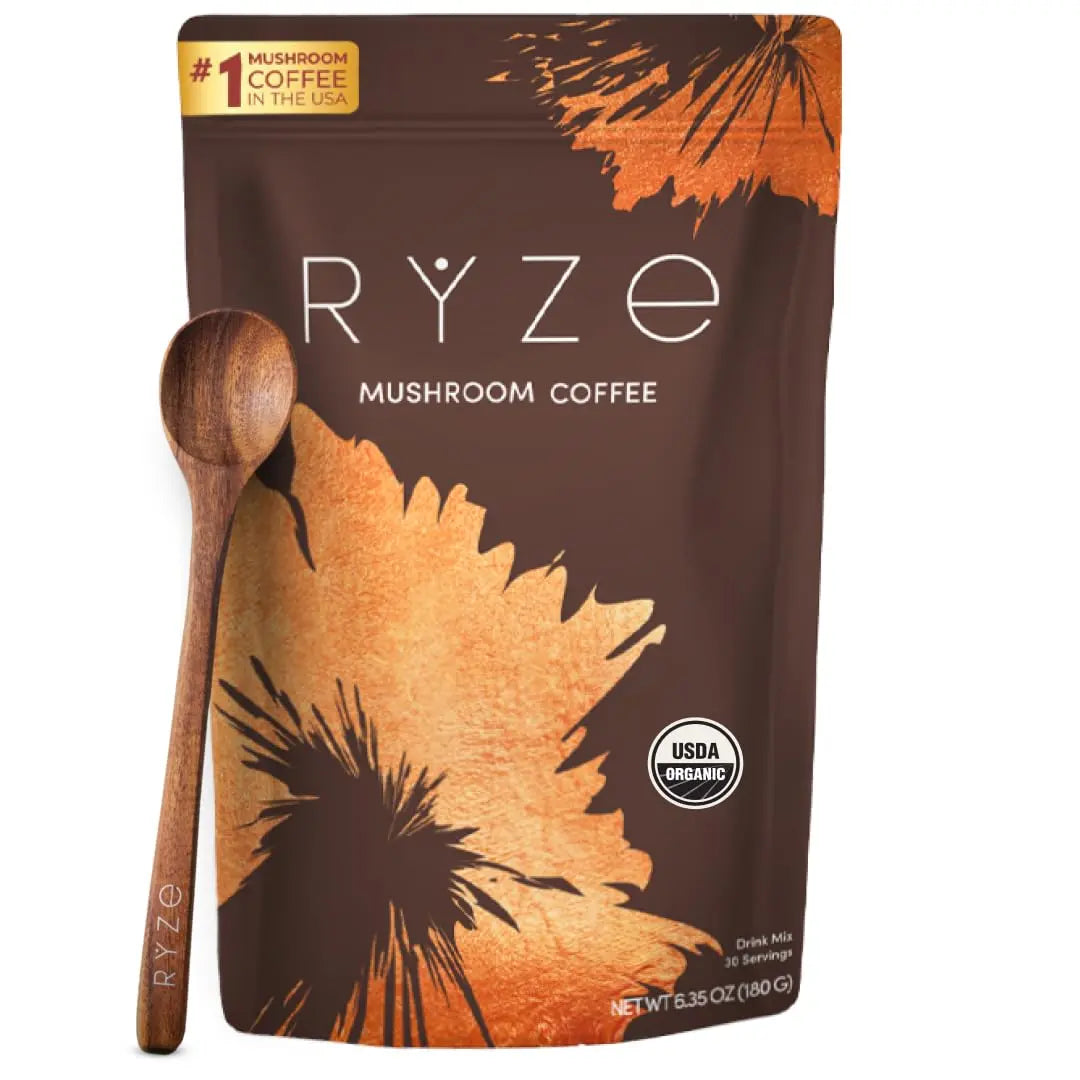 Package of RYZE Superfoods – Adaptogenic Mushroom Coffee with wooden spoon; brown pouch features mushrooms and branding.
